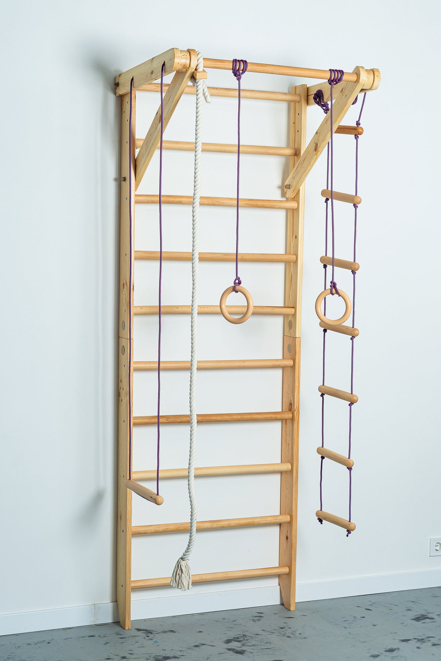 Wooden Wall stall bars with fixed pull up bar and rope items. Home exercises for kids and adults