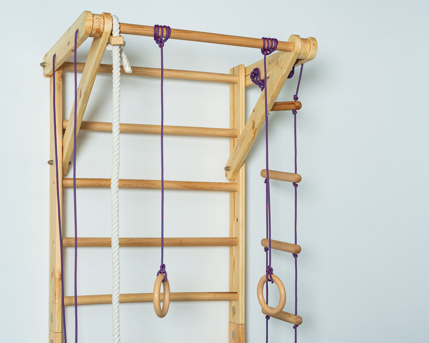 Wooden Wall stall bars with fixed pull up bar and rope items. Home exercises for kids and adults